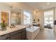 Modern bathroom features dual vanities, a soaking tub, and a separate shower at 24066 S 218Th Pl, Queen Creek, AZ 85142