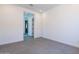 Neutral bedroom with an open doorway to another room of the house at 24066 S 218Th Pl, Queen Creek, AZ 85142