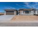 Modern single-Gathering home with stone accents, a two-car garage, and contemporary design at 24066 S 218Th Pl, Queen Creek, AZ 85142