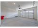 Spacious two car garage with white walls and sealed concrete floor at 24066 S 218Th Pl, Queen Creek, AZ 85142