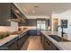 Modern kitchen with stainless steel appliances, a large marble countertop, gray cabinetry, and ample storage space at 24066 S 218Th Pl, Queen Creek, AZ 85142