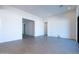 Bright living room with neutral paint, light tile flooring, and recessed lighting creating a modern, open space at 24066 S 218Th Pl, Queen Creek, AZ 85142