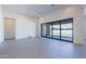 Spacious living room featuring large sliding glass doors that open to a patio, enhancing natural light at 24066 S 218Th Pl, Queen Creek, AZ 85142