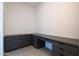 Custom office/study space with a built-in desk and plenty of storage cabinets for an organized and efficient work area at 24066 S 218Th Pl, Queen Creek, AZ 85142