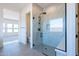 A sleek glass shower showcases stylish marble tiles and a modern showerhead at 24066 S 218Th Pl, Queen Creek, AZ 85142