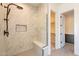 Walk-in shower with stone tiled walls at 24066 S 218Th Pl, Queen Creek, AZ 85142