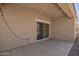 A covered back patio with a sliding glass door at 2420 E San Borja Trl, Casa Grande, AZ 85194