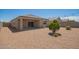 Zero maintenance backyard with covered patio, gravel, and privacy fence at 2420 E San Borja Trl, Casa Grande, AZ 85194