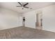 Spacious bedroom with ceiling fan, carpet, neutral paint and two doors at 2420 E San Borja Trl, Casa Grande, AZ 85194