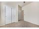 Neutral bedroom with carpet and a double door closet with white doors at 2420 E San Borja Trl, Casa Grande, AZ 85194