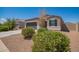 Charming single-story home with a well-manicured front yard, two car garage, and neutral colored stucco at 2420 E San Borja Trl, Casa Grande, AZ 85194