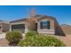 Charming single-story home with a well-manicured front yard, two car garage, and neutral colored stucco at 2420 E San Borja Trl, Casa Grande, AZ 85194