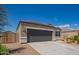 Charming single-story home with a well-manicured front yard, two car garage, and neutral colored stucco at 2420 E San Borja Trl, Casa Grande, AZ 85194