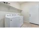 Laundry room with new appliances, tile floor, and shelving at 2420 E San Borja Trl, Casa Grande, AZ 85194