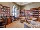 Comfortable library featuring bookshelves, a large window, and cozy seating area at 2420 E San Borja Trl, Casa Grande, AZ 85194