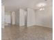 Bright and airy living room with neutral walls and tile flooring, showcasing an open and inviting space at 2420 E San Borja Trl, Casa Grande, AZ 85194