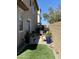 Outdoor space with synthetic lawn, potted plants, and a cozy seating area, great for relaxing at 266 S Eliseo Felix Jr Way, Avondale, AZ 85323