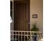 Stylish front door with decorative security screen, tiled house number, and a potted plant, adding curb appeal at 266 S Eliseo Felix Jr Way, Avondale, AZ 85323