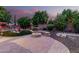 Lush backyard with a fire pit, mature landscaping, and tranquil ambiance at 27406 N 22Nd Ln, Phoenix, AZ 85085