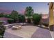 Backyard featuring a fire pit and privacy landscaping for peaceful outdoor enjoyment at 27406 N 22Nd Ln, Phoenix, AZ 85085