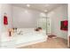 Bathroom view featuring a large tub, glass shower, and neutral walls and floors at 27406 N 22Nd Ln, Phoenix, AZ 85085