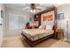 Bedroom featuring a built-in Murphy bed, a work desk, and a neutral color scheme at 27406 N 22Nd Ln, Phoenix, AZ 85085