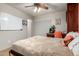 Bright bedroom with a murphy bed, desk area, and tile floors at 27406 N 22Nd Ln, Phoenix, AZ 85085