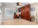 Bedroom view with built-in shelves, a work desk, and an orange office chair at 27406 N 22Nd Ln, Phoenix, AZ 85085