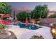 Private pool with a rock waterfall, lush landscaping, and inviting patio space at 27406 N 22Nd Ln, Phoenix, AZ 85085