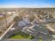 Aerial view showcasing a home with a well-maintained lawn, landscaping, and neighborhood streets, providing a sense of community at 2747 S Brooks --, Mesa, AZ 85202