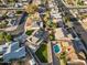 Aerial view of a neighborhood featuring homes with pools, well-kept yards, and streetscapes, highlighting community amenities at 2747 S Brooks --, Mesa, AZ 85202