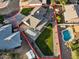 Aerial view of property highlighting landscaping, pool, covered parking, and surrounding neighborhood at 2747 S Brooks --, Mesa, AZ 85202