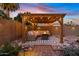 Outdoor space with a pergola, comfortable seating, and a fire pit, perfect for relaxing and entertaining under the stars at 2747 S Brooks --, Mesa, AZ 85202