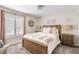 Well-lit bedroom with plush carpet, wood furnishings, and neutral accents at 2747 S Brooks --, Mesa, AZ 85202