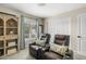 Relaxing living room featuring theater seating, a cozy window, and custom shelving at 2747 S Brooks --, Mesa, AZ 85202