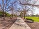 Enjoy an afternoon stroll on the picturesque walking path with mature trees and benches at 2747 S Brooks --, Mesa, AZ 85202