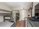 Bedroom with bunk beds, closet with mirrored doors, and wood-look flooring at 28 W Hillside St, Mesa, AZ 85201