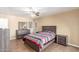 Bedroom featuring neutral tones, ceiling fan, and wood-look floors at 28 W Hillside St, Mesa, AZ 85201