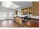 Bright kitchen featuring wood cabinets, stainless steel appliances, and wood-look flooring at 28 W Hillside St, Mesa, AZ 85201