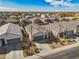 Aerial view of a home with a landscaped yard in a residential neighborhood at 30747 W Indianola Ave, Buckeye, AZ 85396