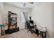 Bedroom with a ceiling fan, desk, and closet at 30747 W Indianola Ave, Buckeye, AZ 85396