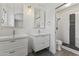 Bright bathroom featuring double sinks and a modern shower with tiled walls at 324 W Culver St # 2, Phoenix, AZ 85003