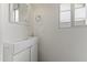 Clean bathroom with modern sink, mirror, and towel rack against a white wall at 324 W Culver St # 2, Phoenix, AZ 85003