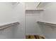 Walk-in closet with wooden shelves and hardwood floors for plenty of storage at 324 W Culver St # 2, Phoenix, AZ 85003