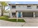 Charming townhome with a blue door, a two-car garage, and landscaped front yard at 324 W Culver St # 2, Phoenix, AZ 85003