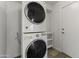 Modern laundry setup with a stackable washer and dryer in a dedicated room at 324 W Culver St # 2, Phoenix, AZ 85003