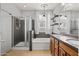 Well-appointed bathroom featuring a walk-in shower, a soaking tub, a double sink vanity, and elegant fixtures at 337 S 172Nd Dr, Goodyear, AZ 85338