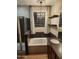 Bathroom featuring stand alone tub, glass-doored shower, and pendant lighting at 337 S 172Nd Dr, Goodyear, AZ 85338