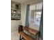 Bright dining nook next to window, featuring rustic wood table, floating shelves and wood-look accent at 337 S 172Nd Dr, Goodyear, AZ 85338