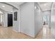 Hallway featuring tile flooring, neutral walls, and access to rooms throughout the home at 337 S 172Nd Dr, Goodyear, AZ 85338